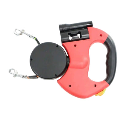 Red retractable dog leash with black handle on a white background