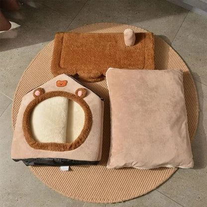 Pet bed with house and cushion design on a textured surface